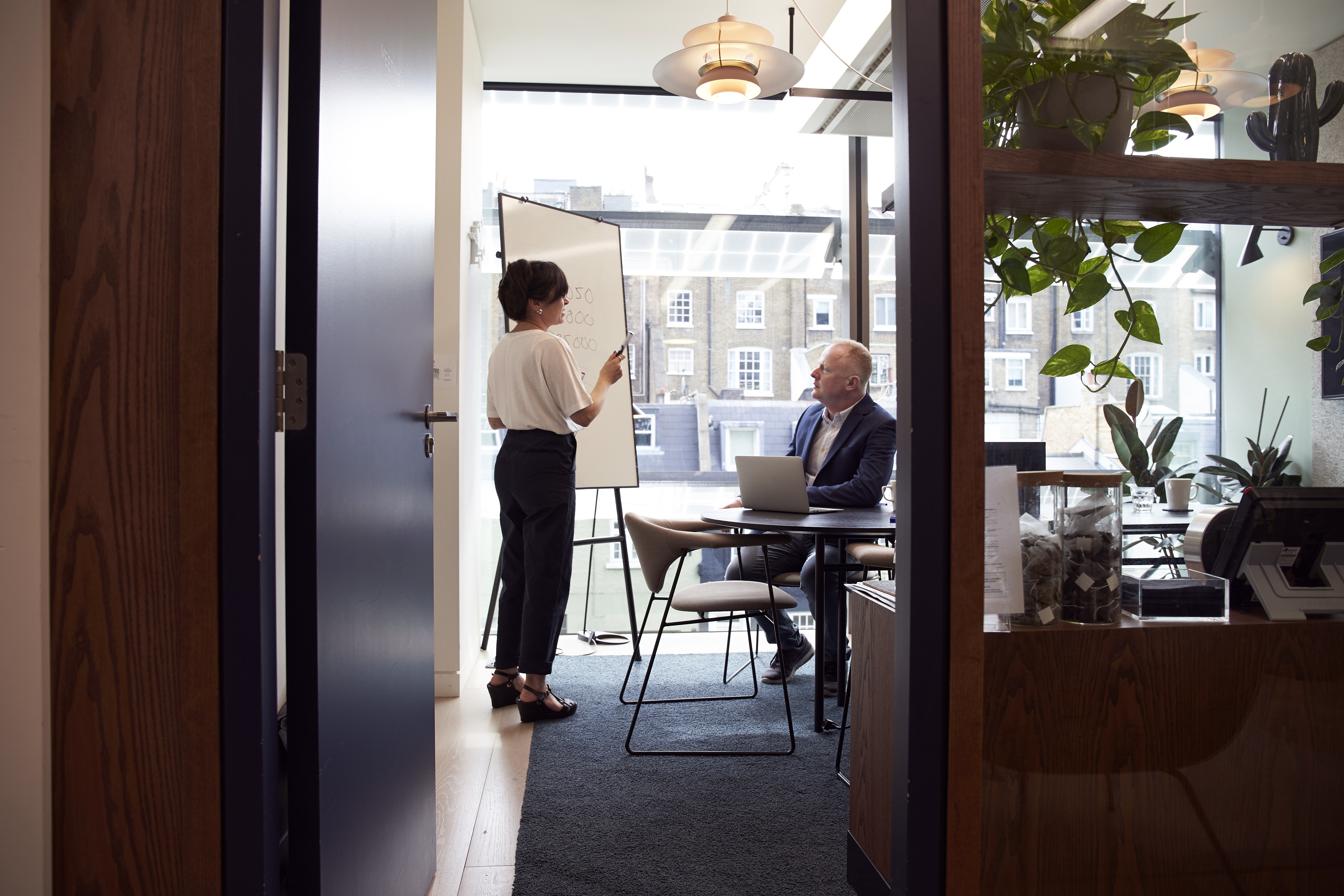 woman leading meeting with man