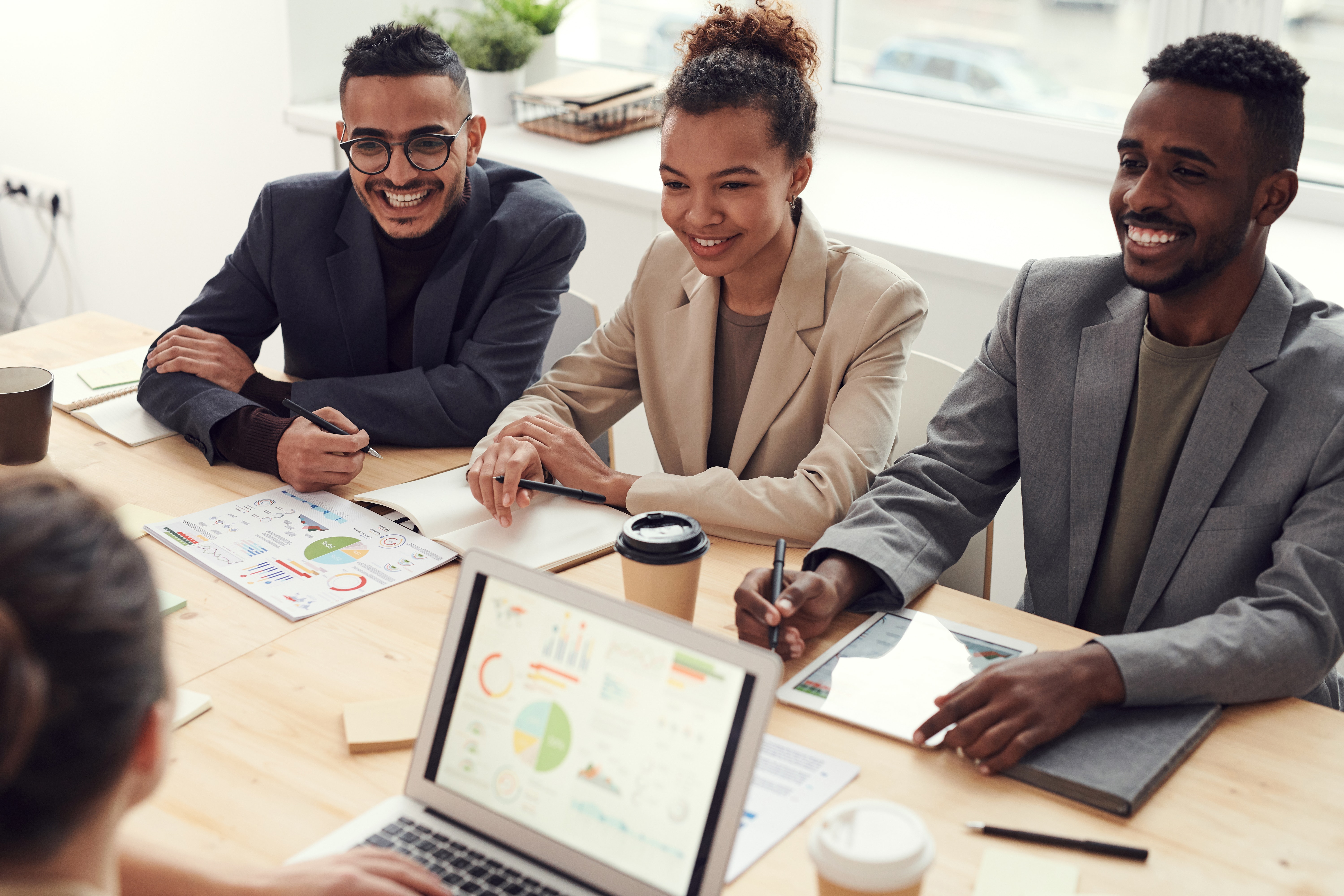 3 professionals in a meeting