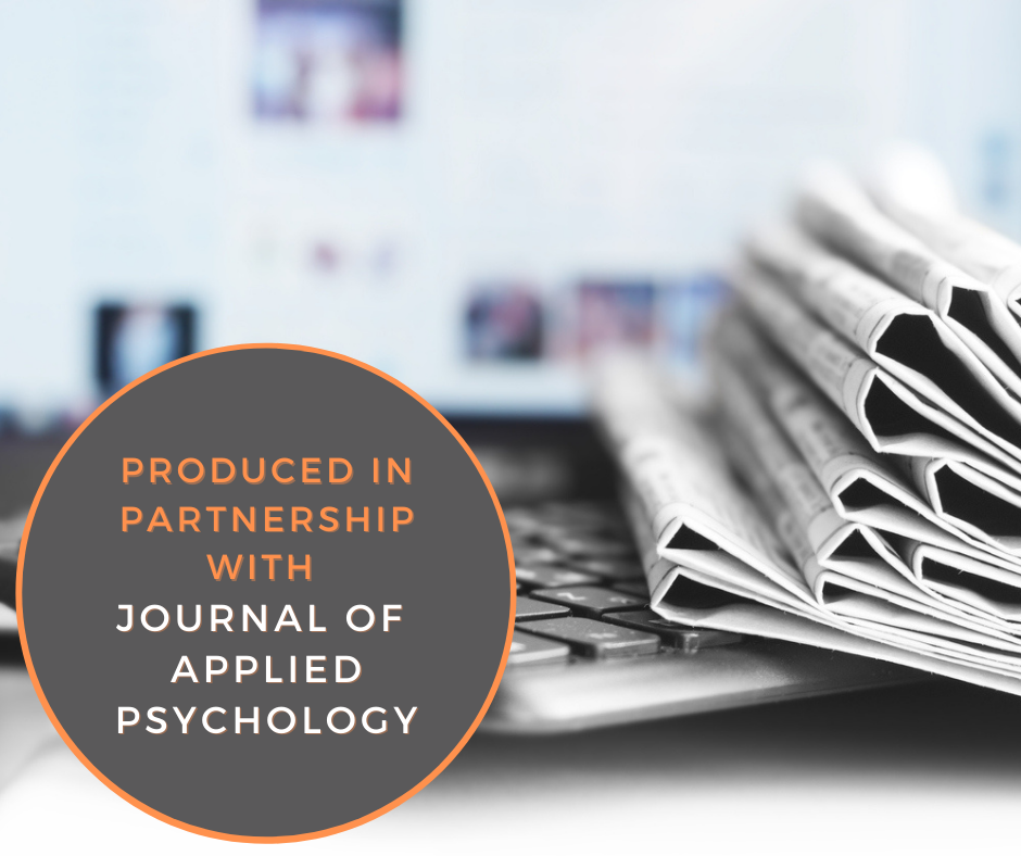 news articles on laptop desk