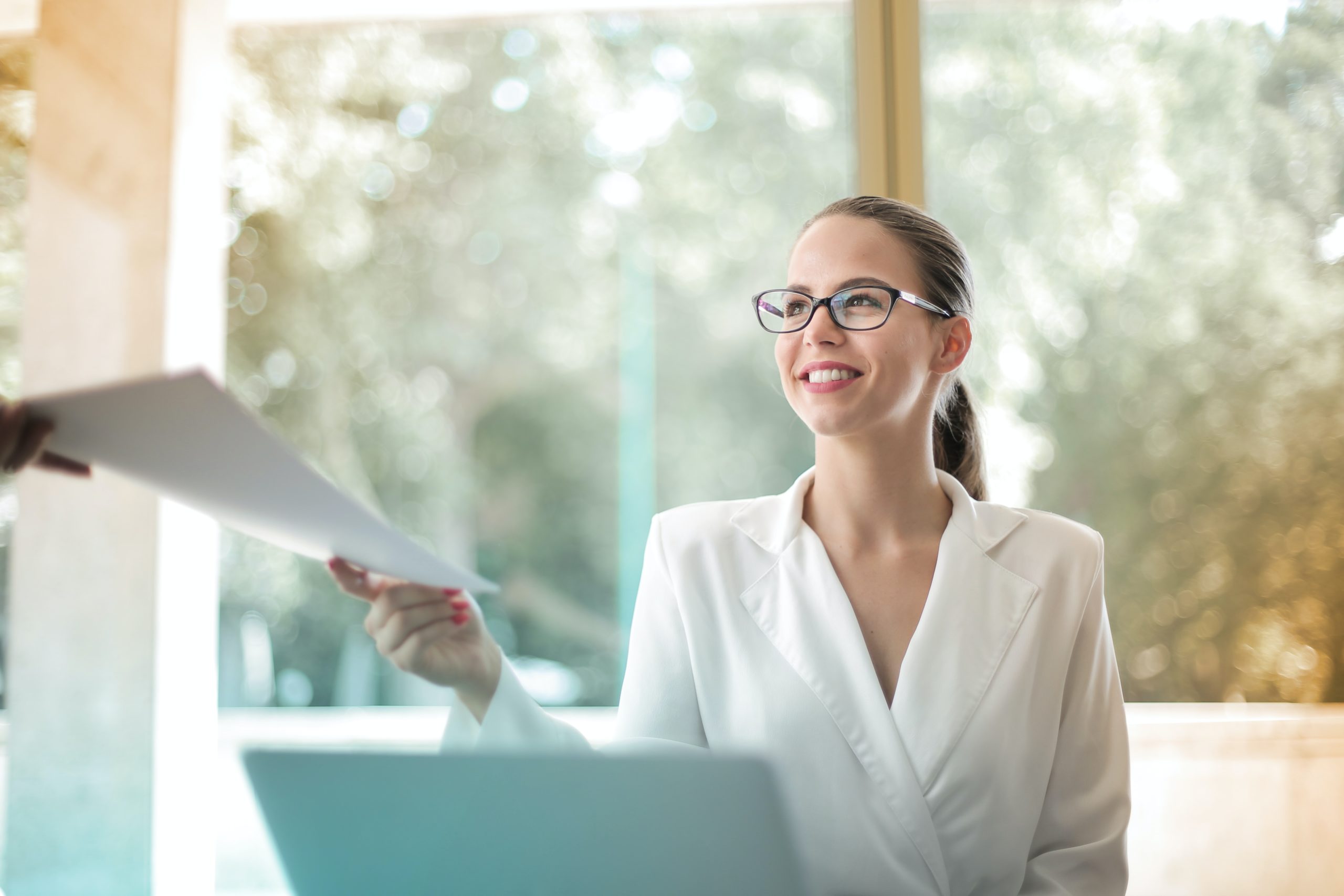 female employee submitting documents