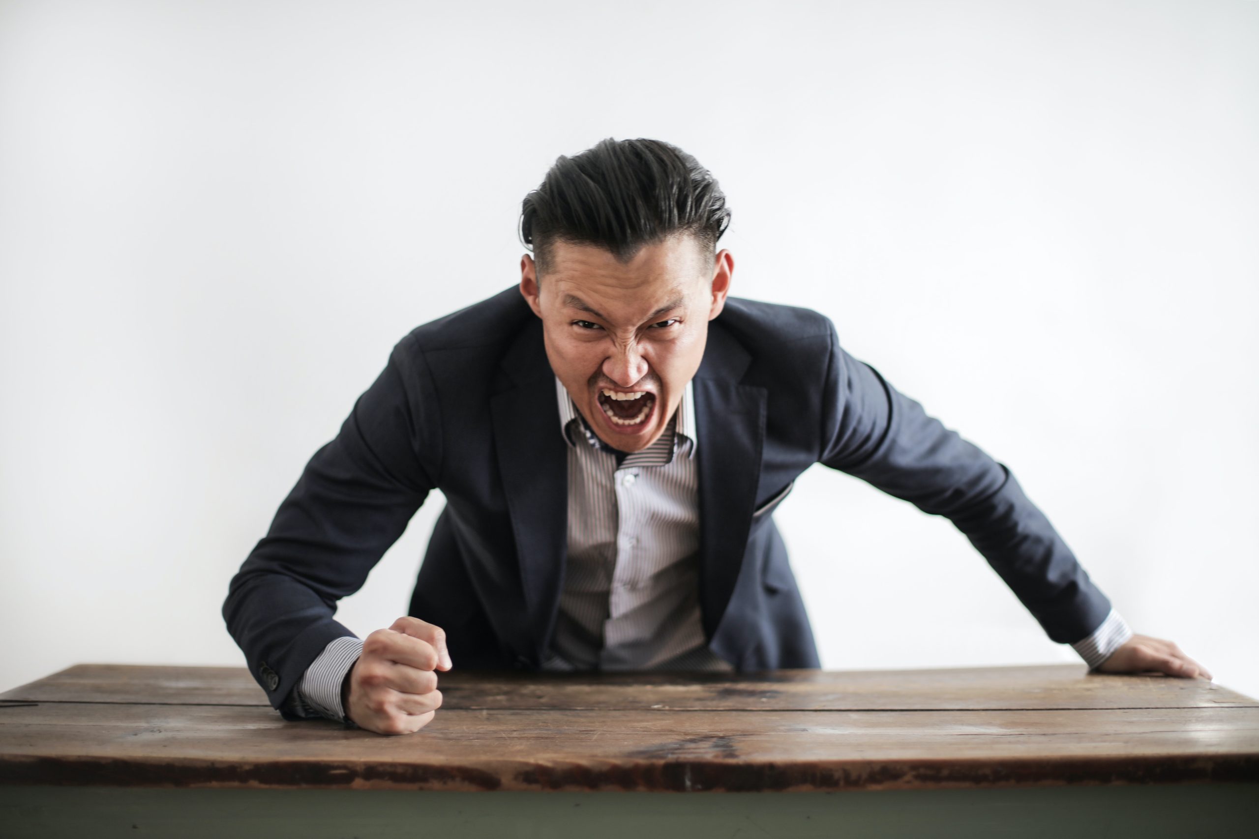 angry boss slapping table