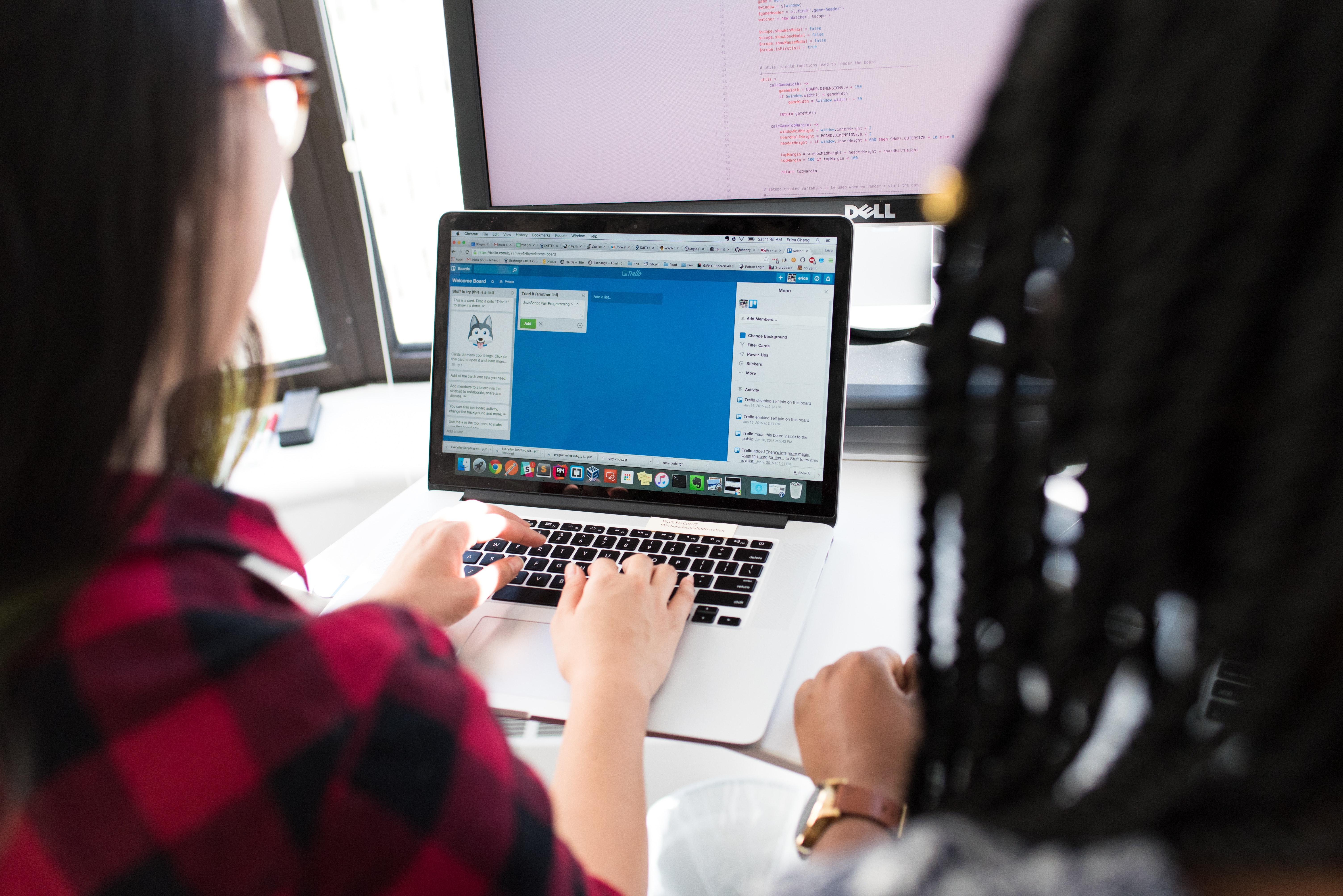 2 women in front of computer